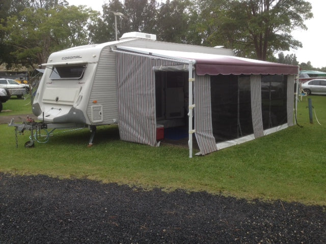 a caravan with the awnings extended